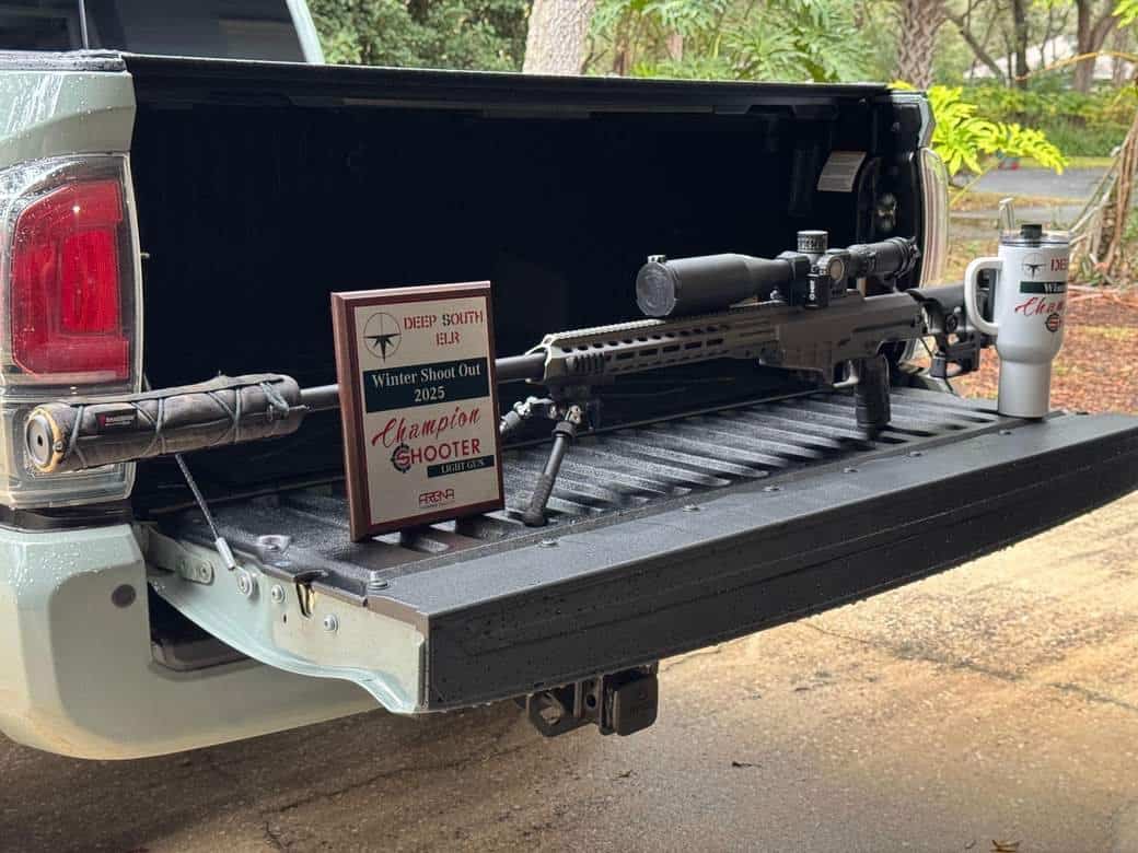 Deep South ELR Winter Shoot Out 2025 champion shooter plaque beside a rifle on a truck tailgate